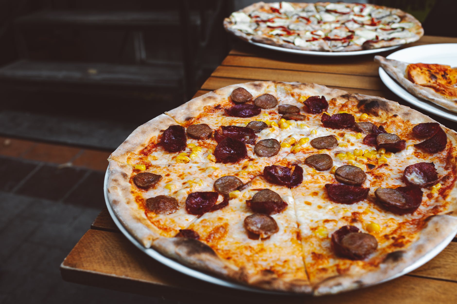 pizza on brown wooden table